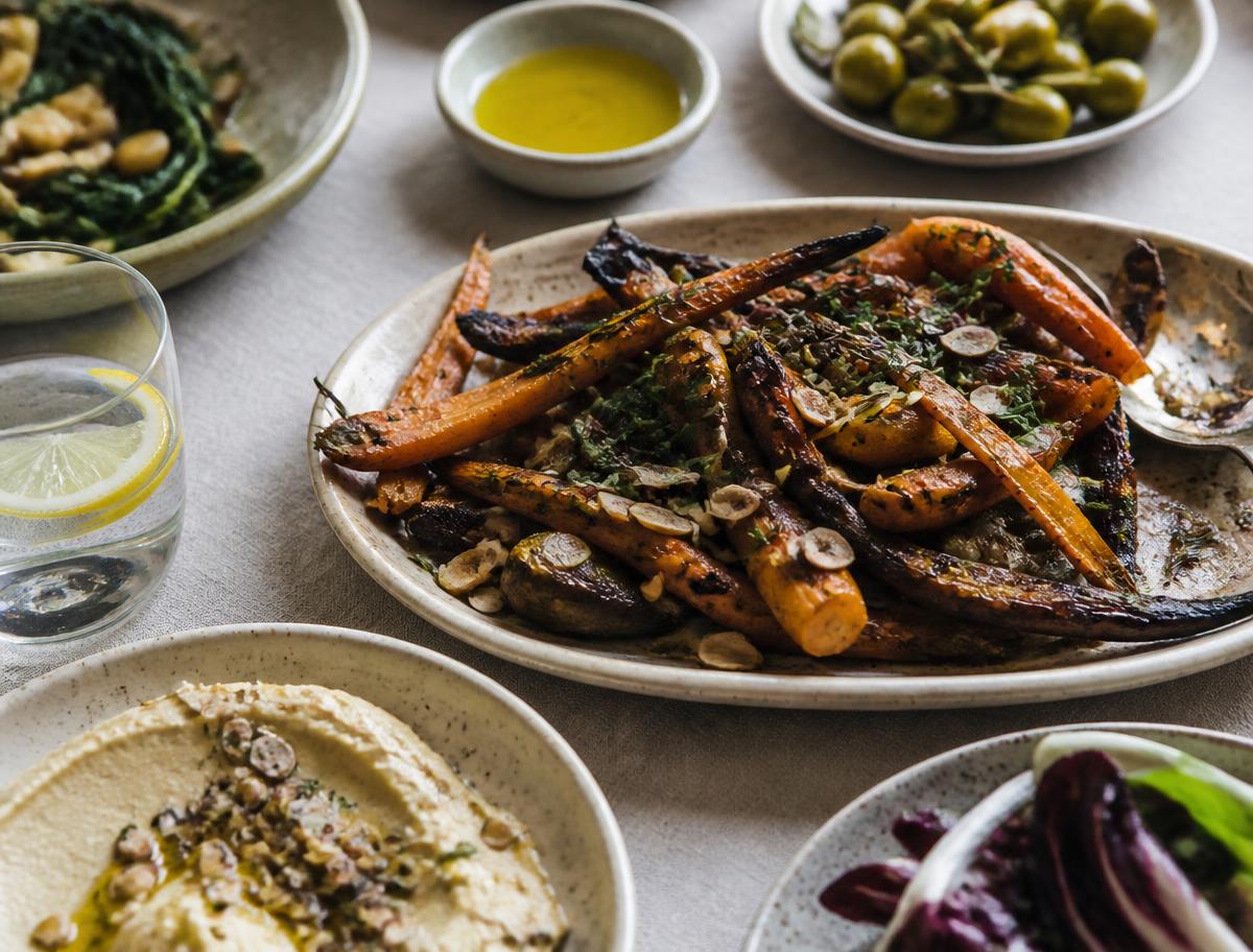 Seasonal sharing plates on a linen table